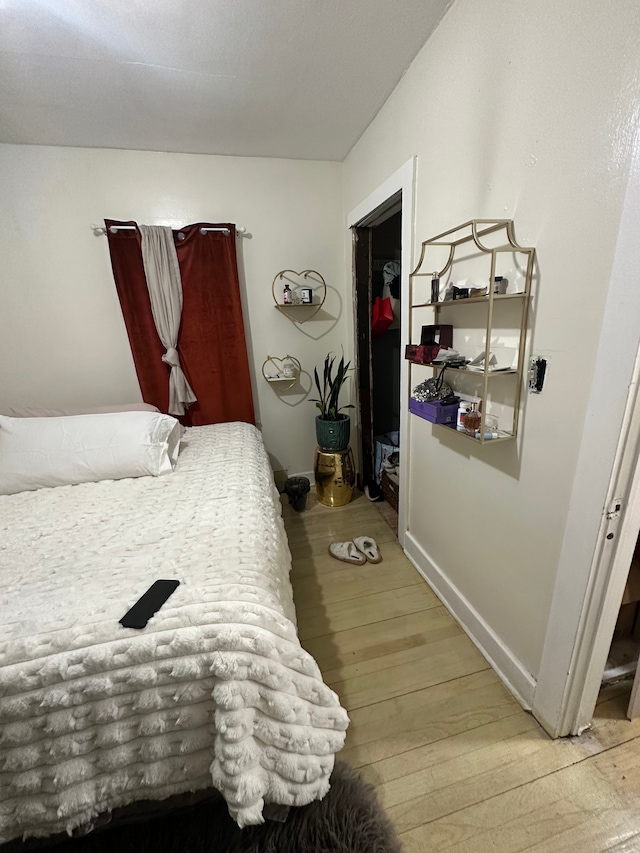 bedroom featuring hardwood / wood-style floors