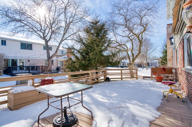 view of snow covered deck