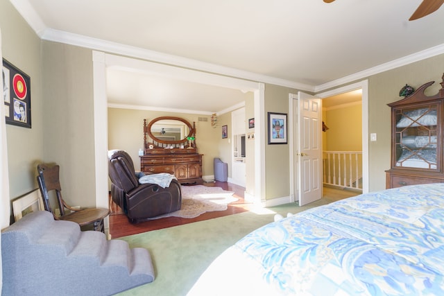 bedroom featuring ornamental molding and light carpet