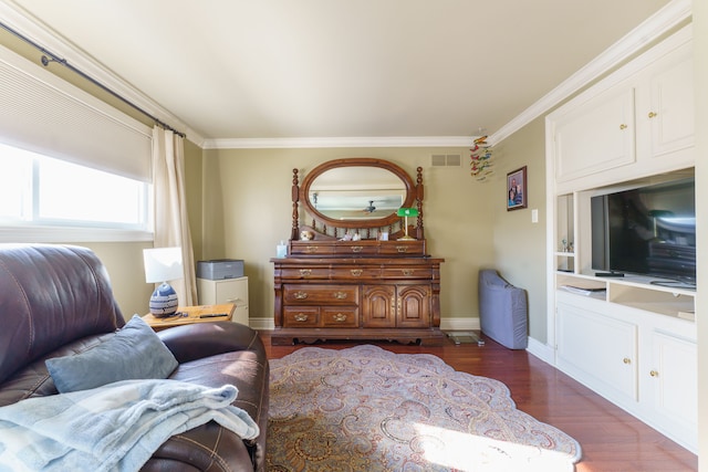 living area featuring ornamental molding and dark hardwood / wood-style flooring