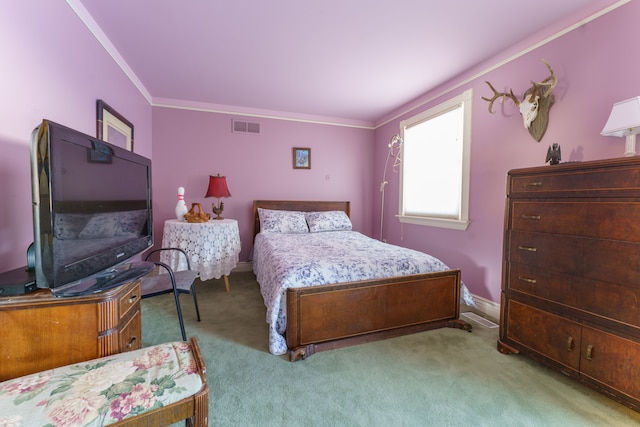 carpeted bedroom with crown molding