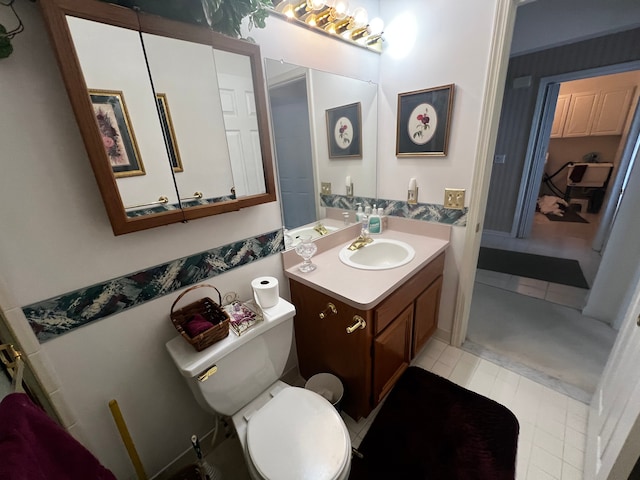 bathroom with toilet and vanity