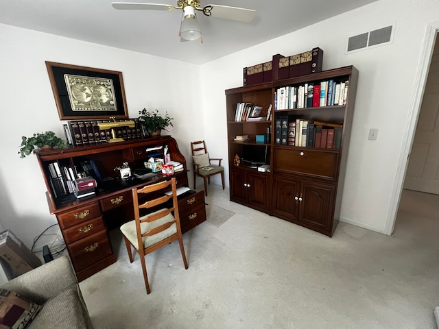 office with light carpet, ceiling fan, visible vents, and baseboards