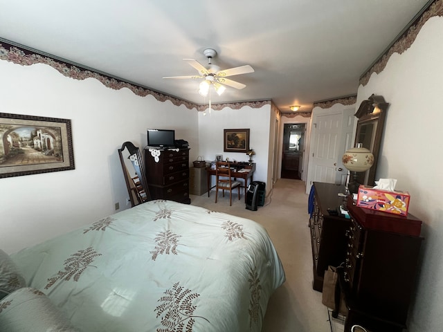 bedroom featuring a ceiling fan and light colored carpet