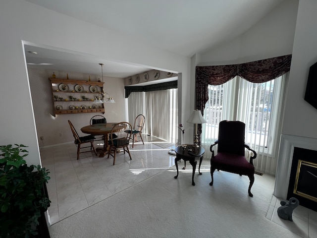 dining room with lofted ceiling