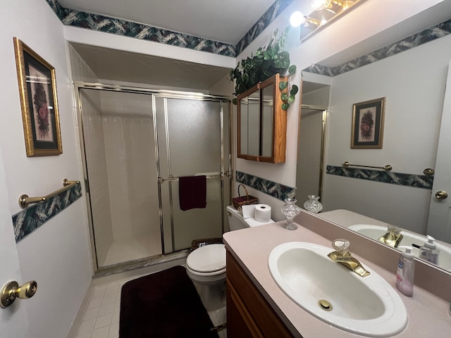 full bath featuring toilet, a shower stall, and vanity