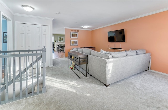 carpeted living room with crown molding