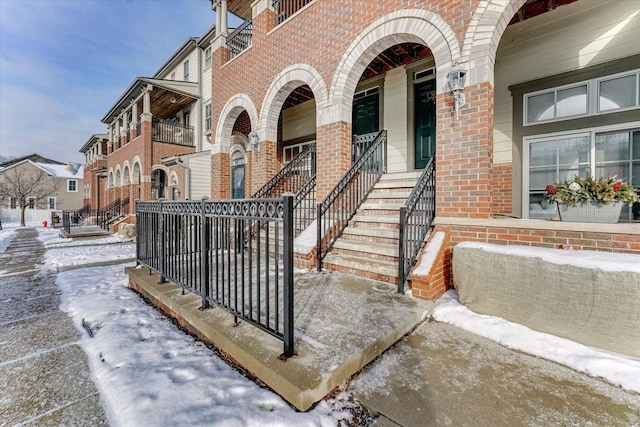 view of snow covered property entrance