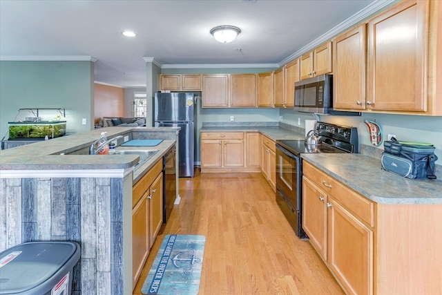 kitchen featuring sink, ornamental molding, light hardwood / wood-style floors, light brown cabinetry, and black appliances