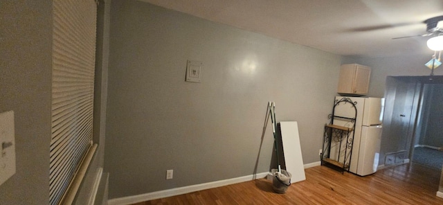 interior space with ceiling fan and light wood-type flooring