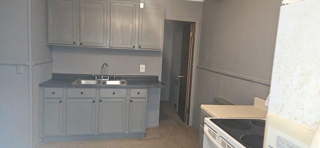 kitchen with sink, gray cabinetry, and electric stove