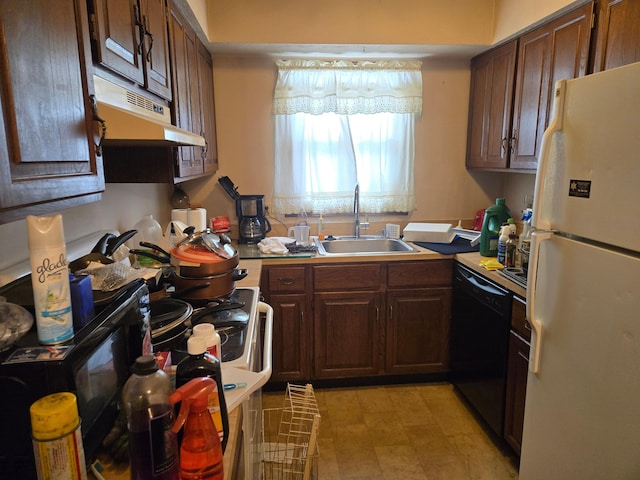 kitchen featuring white refrigerator, black dishwasher, and sink