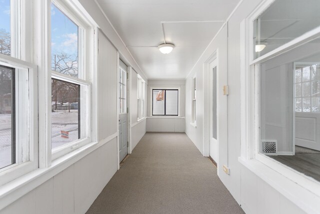 corridor with light colored carpet