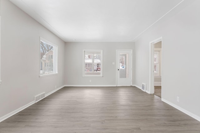 unfurnished room featuring wood-type flooring