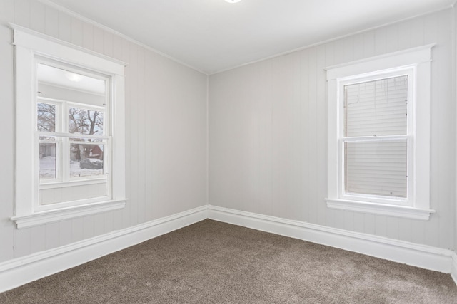 carpeted empty room with ornamental molding