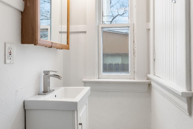 bathroom with vanity and plenty of natural light