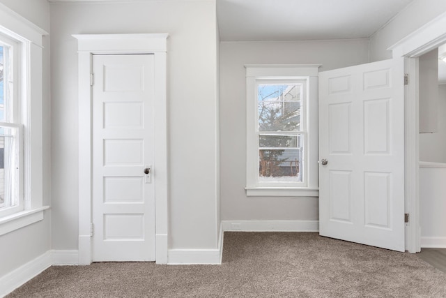 unfurnished bedroom with carpet flooring