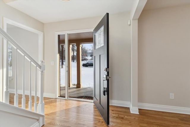 entryway with wood-type flooring