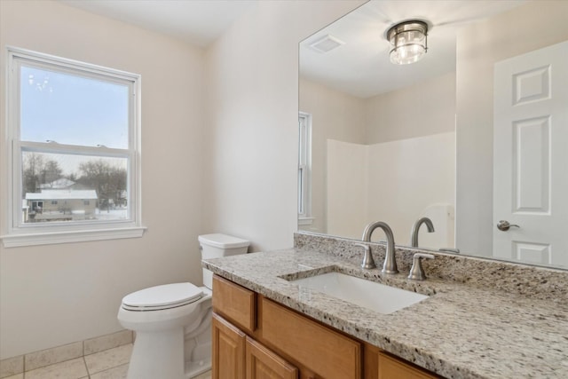 bathroom featuring toilet, tile patterned flooring, and vanity