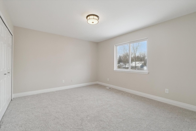 unfurnished bedroom with a closet and carpet