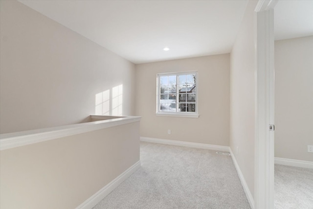 hallway with light carpet