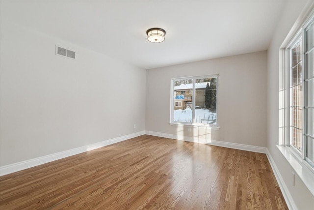 empty room with wood-type flooring