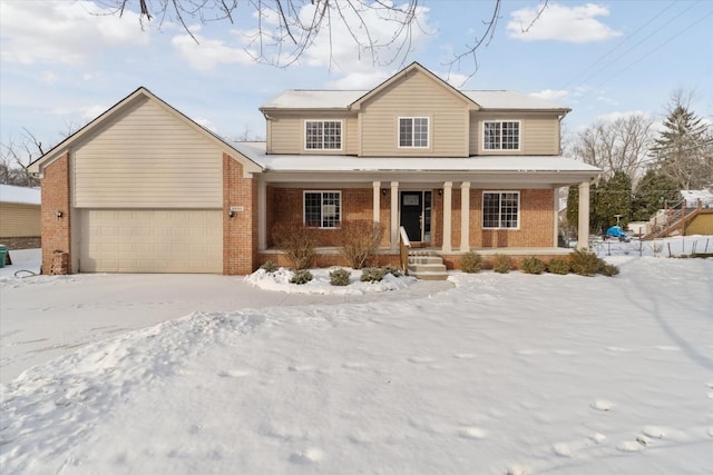 view of front of home with a porch and a garage