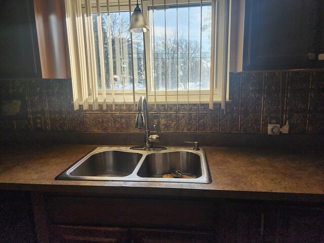 kitchen featuring sink and backsplash