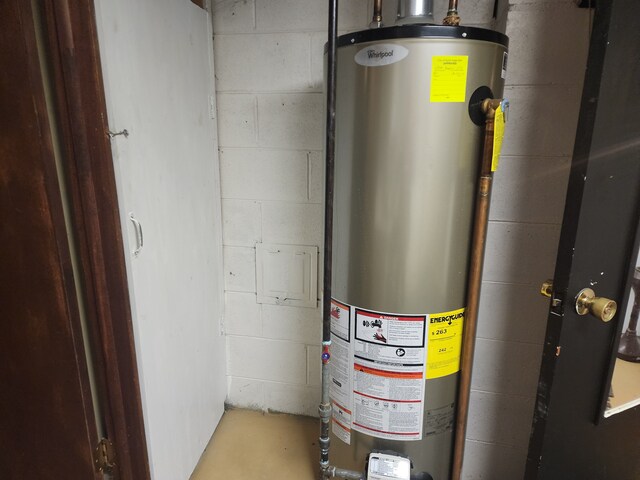 utility room with gas water heater