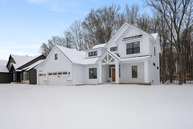 modern inspired farmhouse with a garage