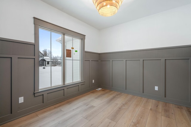 empty room with light wood-type flooring