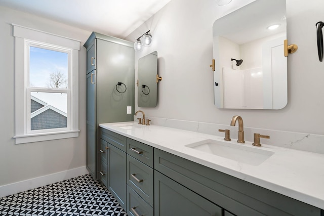 bathroom with walk in shower and vanity