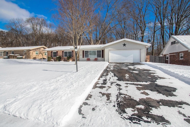 single story home featuring a garage