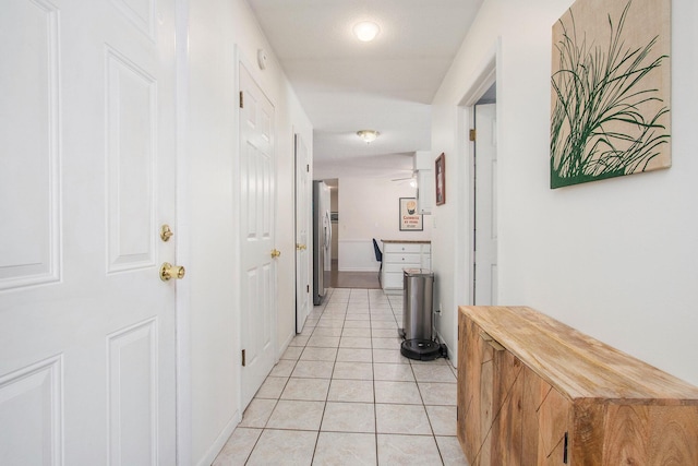 corridor featuring light tile patterned flooring