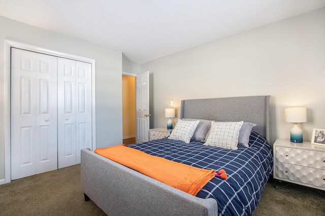 bedroom with a closet and dark colored carpet