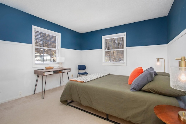 bedroom with light colored carpet