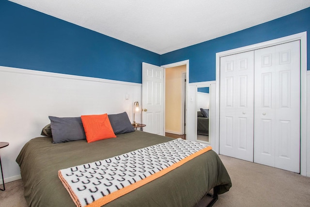 carpeted bedroom with a closet