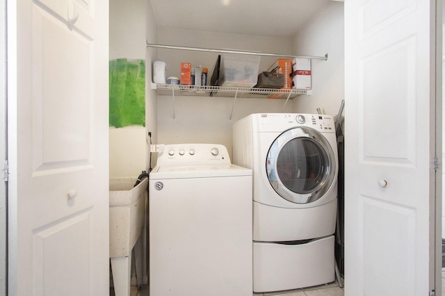 washroom with washer and clothes dryer