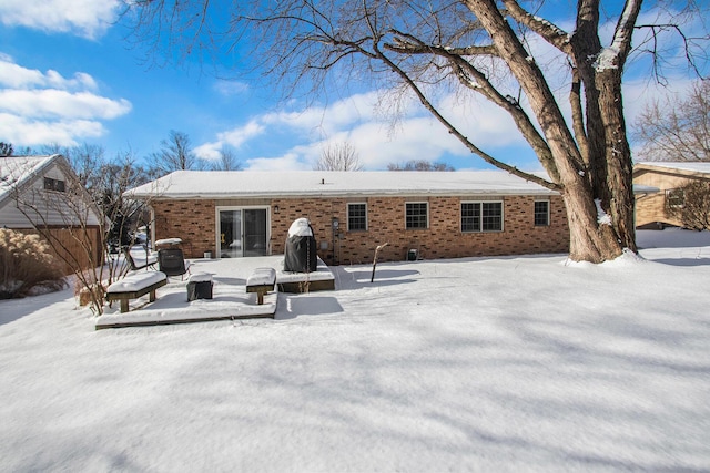 view of snow covered house