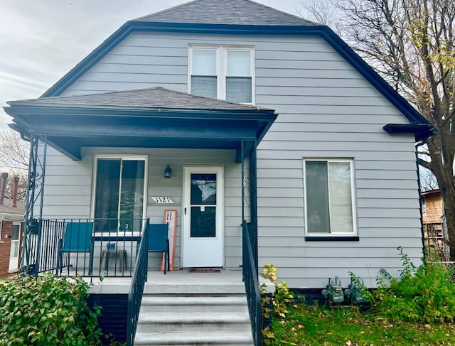 rear view of house with a porch