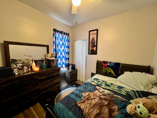 bedroom with ceiling fan and hardwood / wood-style floors