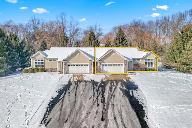 single story home with a garage