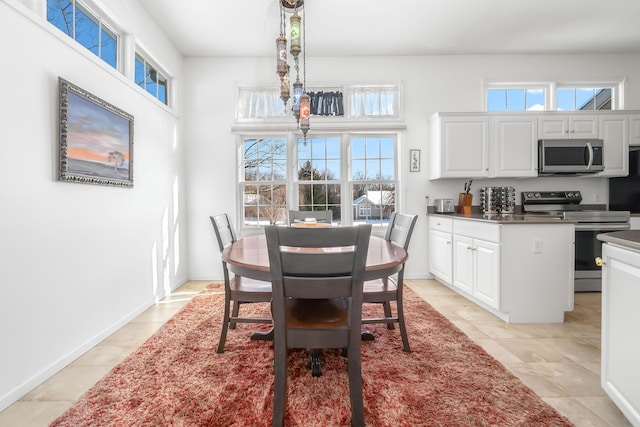 dining area with light tile patterned flooring