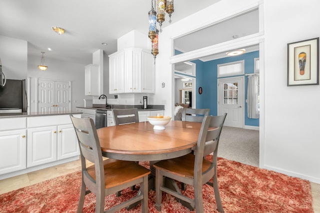 dining space with light carpet