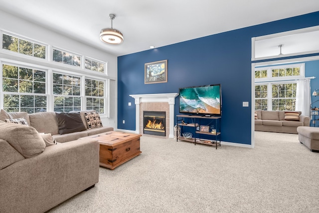 living room with carpet flooring and a fireplace