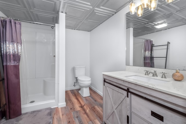 bathroom featuring hardwood / wood-style floors, toilet, vanity, and a shower with curtain