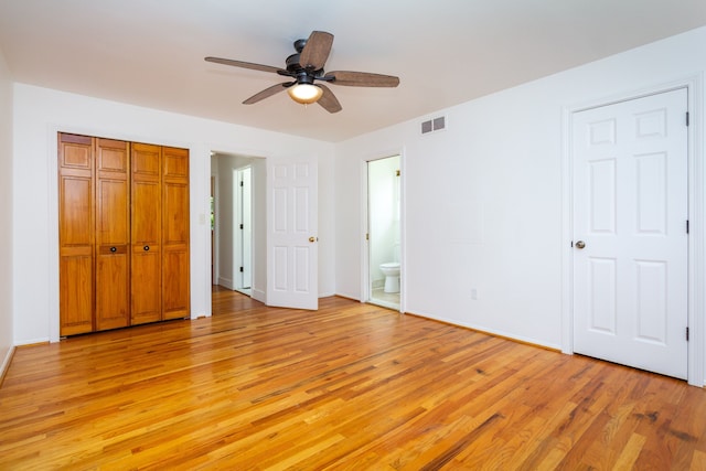 21918 Knudsen Dr, Grosse Ile, MI 48138 - unfurnished bedroom featuring light wood finished floors, ensuite bathroom, baseboards, and a closet