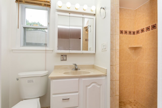 21918 Knudsen Dr, Grosse Ile, MI 48138 - bathroom featuring tiled shower, toilet, and vanity