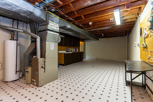 21918 Knudsen Dr, Grosse Ile, MI 48138 - unfinished below grade area with gas water heater, heating unit, and light flooring