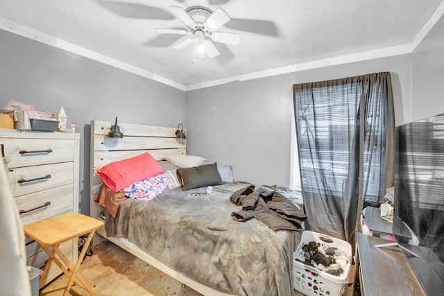 bedroom featuring ceiling fan and ornamental molding